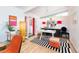 Bright home office features modern decor, a large desk, and a fun, productive atmosphere with natural light at 1831 S Ivanhoe St, Denver, CO 80224