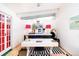 Stylish home office with a modern desk, bright pink lamps, and a striped rug that adds character at 1831 S Ivanhoe St, Denver, CO 80224