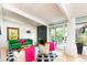 Bright living room with a modern fireplace, comfortable seating, and a seamless transition to the outdoors at 1831 S Ivanhoe St, Denver, CO 80224