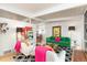 Spacious living room boasts bright and colorful furnishings with white walls and white-beamed ceilings at 1831 S Ivanhoe St, Denver, CO 80224