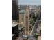 Aerial view of a city with many buildings, including a clock tower at 444 17Th St # 1003, Denver, CO 80202