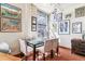 Dining area with a glass table, four chairs, and natural light from a window at 444 17Th St # 1003, Denver, CO 80202