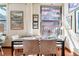 A naturally lit dining room shows a city view with seating for four at 444 17Th St # 1003, Denver, CO 80202