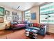 Charming living room featuring modern décor with daybed, city view and creative lighting at 444 17Th St # 1003, Denver, CO 80202