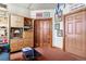 A living room features a bookshelf, stylish doors, and unique wall art at 444 17Th St # 1003, Denver, CO 80202