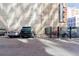 Parking area with multiple vehicles parked, located next to the building at 444 17Th St # 1003, Denver, CO 80202