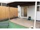 Backyard area featuring cement patio, grass, and wooden fence at 3073 W Center Ave # C, Denver, CO 80219