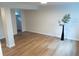 Spacious basement with laminate flooring and white walls at 3073 W Center Ave # C, Denver, CO 80219