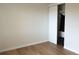 Bright bedroom with laminate flooring and a closet with sliding doors at 3073 W Center Ave # C, Denver, CO 80219