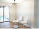 Bright dining area with stylish lighting, modern furniture, and access to the backyard at 3073 W Center Ave # C, Denver, CO 80219