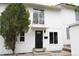 Charming two-story home with a striking black front door and well-maintained landscaping at 3073 W Center Ave # C, Denver, CO 80219