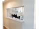 View of kitchen featuring white cabinets and countertops at 3073 W Center Ave # C, Denver, CO 80219