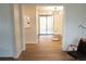 Open-concept area with hardwood floors, a dining area, and access to the backyard at 3073 W Center Ave # C, Denver, CO 80219