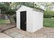Outdoor shed with a black door and surrounded by gravel at 3073 W Center Ave # C, Denver, CO 80219