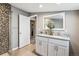 Bathroom featuring a granite countertop double vanity and tiled walk in shower at 1194 S Washington St, Denver, CO 80210