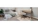 Bedroom and office combination space featuring a bed, desk, and houseplant at 1194 S Washington St, Denver, CO 80210