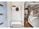 Stylish entryway showcasing a spiral staircase, hat rack, hardwood floors, and modern decor for an elegant welcome at 1194 S Washington St, Denver, CO 80210