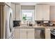 Bright kitchen with stainless steel appliances, granite countertops, and modern cabinetry, creating a functional workspace at 1194 S Washington St, Denver, CO 80210