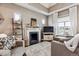 Cozy living room with a fireplace, comfortable seating, natural light, and stylish decor, perfect for relaxing at 1194 S Washington St, Denver, CO 80210