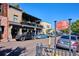 Street view of Old South Pearl Street with shops, restaurants, and parked cars on a sunny day at 1194 S Washington St, Denver, CO 80210