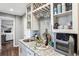Well-organized wet bar with granite countertop, wine rack, and modern backsplash at 1194 S Washington St, Denver, CO 80210
