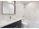 Modern bathroom with a sleek vanity, white tile walls, and stylish fixtures at 5358 Lions Paw St, Castle Rock, CO 80104