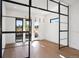 Modern dining room with hardwood floors, glass walls, and stylish pendant lighting at 5358 Lions Paw St, Castle Rock, CO 80104