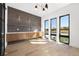 Dining room with built-in cabinets, modern lighting, large windows, and wood floors at 5358 Lions Paw St, Castle Rock, CO 80104