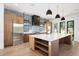 Stylish kitchen featuring a large island, stainless steel appliances, and pendant lighting at 5358 Lions Paw St, Castle Rock, CO 80104