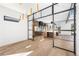 Open-concept layout with chef's kitchen, stainless appliances, island, and hardwood floors at 5358 Lions Paw St, Castle Rock, CO 80104