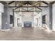 Grand living room features a high ceiling, fireplace, modern lighting fixtures, and an open floor plan at 5358 Lions Paw St, Castle Rock, CO 80104