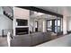 Spacious living room with a modern fireplace, hardwood floors, and an open floor plan at 5358 Lions Paw St, Castle Rock, CO 80104