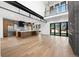Open living space showcasing the kitchen, living room, and second-story balcony with modern lighting at 5358 Lions Paw St, Castle Rock, CO 80104