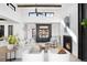Bright living room with high ceilings, modern fireplace, and comfortable seating area at 5358 Lions Paw St, Castle Rock, CO 80104