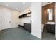 Well-designed mudroom with built-in shelves, hexagon tile floors and access to half bath at 5358 Lions Paw St, Castle Rock, CO 80104