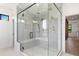 Spacious shower features glass enclosure, dual shower heads and mosaic tile design at 5358 Lions Paw St, Castle Rock, CO 80104