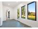 Bright sunroom features hexagon tile floors, lots of natural light and outdoor access at 5358 Lions Paw St, Castle Rock, CO 80104