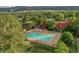 Aerial view of community pool and recreational facilities with mature trees and open space at 11886 Elk Head Range Rd, Littleton, CO 80127