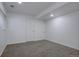 Finished basement space with neutral carpet, freshly painted white walls, and a window offering natural light at 11886 Elk Head Range Rd, Littleton, CO 80127