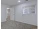 Finished basement space with neutral carpet, freshly painted white walls, and a door for added privacy at 11886 Elk Head Range Rd, Littleton, CO 80127