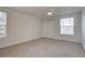 Bedroom with neutral carpet, ceiling fan, closet doors and a window providing natural light at 11886 Elk Head Range Rd, Littleton, CO 80127