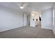 Bedroom with neutral carpet, ceiling fan, and an ensuite bathroom at 11886 Elk Head Range Rd, Littleton, CO 80127