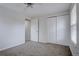 Bedroom with a large closet and an interior door at 11886 Elk Head Range Rd, Littleton, CO 80127