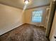 Bedroom featuring neutral walls, wall-to-wall carpet, and a built-in closet at 912 E 6Th Ave, Broomfield, CO 80020
