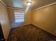 Bedroom with neutral walls, horizontal blinds, and wall-to-wall carpeting at 912 E 6Th Ave, Broomfield, CO 80020