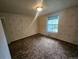 Bedroom with floral wallpaper, overhead lighting and a window at 912 E 6Th Ave, Broomfield, CO 80020