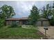 Inviting single-story home with well-manicured lawn and a charming exterior at 912 E 6Th Ave, Broomfield, CO 80020