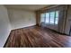 Living room featuring hardwood floors and a large window, providing natural light at 912 E 6Th Ave, Broomfield, CO 80020