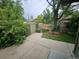 Backyard features a shed with concrete pad and mature trees at 912 E 6Th Ave, Broomfield, CO 80020