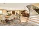 Finished basement with a wet bar and curved staircase at 2 Cherry Hills Farm Dr, Cherry Hills Village, CO 80113